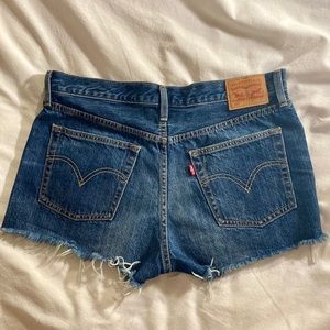 Cutoff Levi’s 501 medium blue jean shorts, size 31